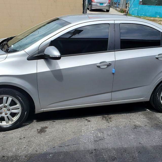 Silver Chevrolet sedan, side view